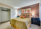 Thumbnail 15 of 29 - a bedroom with a bed and two nightstands
