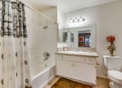 Thumbnail 25 of 29 - a bathroom with a shower toilet and sink