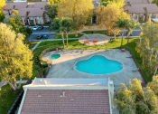 Thumbnail 9 of 29 - an aerial view of a backyard with a pool and hot tub