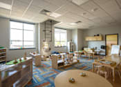 Thumbnail 22 of 24 - A room with a blue carpet and wooden furniture.