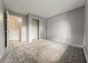 Thumbnail 22 of 49 - A room with a carpeted floor and two doors. at Integrity Berea Apartments, Berea, Ohio