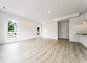 Thumbnail 6 of 18 - A spacious room with wooden flooring and white walls at Westwood Meadows, Westlake, OH, 44145
