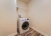 Thumbnail 16 of 49 - A washing machine is sitting in a corner of a room. at Integrity Berea Apartments, Ohio