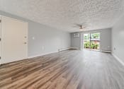 Thumbnail 5 of 49 - A room with a wooden floor and a ceiling fan. at Integrity Berea Apartments, Ohio, 44017