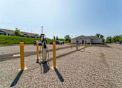 Thumbnail 30 of 39 - A parking lot with a charging station for electric vehicles.