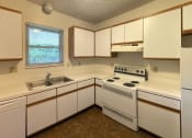 Thumbnail 10 of 22 - Classic modern kitchen at Woodland Pointe Apartments and Townhomes, Integrity Realty, Ohio, 44240