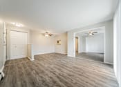 Thumbnail 15 of 21 - Living room with entrance to Dining Room at Integrity Chardon Apartments, Chardon,  Ohio