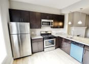 Thumbnail 12 of 32 - Chelsea Renovated Kitchen at Integrity Gold Coast Apartments, Lakewood, 44102