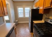 Thumbnail 17 of 32 - Kitchen at Integrity Gold Coast Apartments, Lakewood, OH