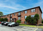 Thumbnail 18 of 36 - Apartment exterior and parking area.