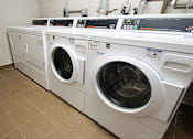 Thumbnail 35 of 36 - Community laundry room.