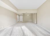 Thumbnail 20 of 42 - A spacious living room with a carpeted floor and white walls.at Atrium in The Village, Ohio