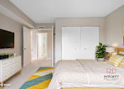 Thumbnail 27 of 42 - A furnished guest bedroom with a large closet.at Atrium in The Village, Ohio