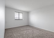 Thumbnail 10 of 15 - Carpeted bedroom with window at Integrity Medina Apartments, Medina, 44256