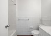 Thumbnail 29 of 32 - Updated Wynwood bathroom featuring all white counters and new bathtub.