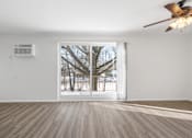 Thumbnail 17 of 32 - Updated Wynwood living room with sliding glass door to balcony.