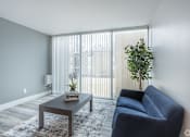 Thumbnail 1 of 13 - Living room with plank flooring at Eagles Landing Apartments, Integrity Realty, Ohio