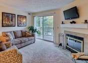 Thumbnail 8 of 46 - Furnished carpeted living room at Hunt Club Apartments, Copley, OH