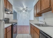 Thumbnail 5 of 14 - Galley Style Kitchen at Huntington Hills Townhomes, Integrity Realty, Stow, 44224