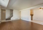 Thumbnail 3 of 14 - Living room with plank flooring at Huntington Hills Townhomes, Integrity Realty, Stow, OH