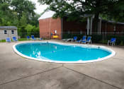 Thumbnail 4 of 14 - Welcoming pool in a wooded setting at Ryan Place Apartments, Integrity Realty, Ohio, 44240