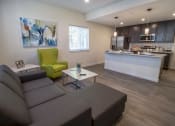Thumbnail 9 of 18 - View of the shared living room, kitchen and dining island