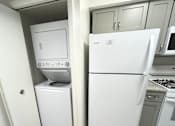 Thumbnail 15 of 42 - In-unit washer/dryer off of kitchen at Atrium in The Village, Beachwood, OH