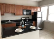 Thumbnail 13 of 32 - Renovated Kitchen at Integrity Gold Coast Apartments in Lakewood, Ohio, 44102
