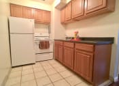 Thumbnail 7 of 25 - Non-renovated kitchen at Integrity Berea Apartments, Integrity Realty LLC, Berea, OH