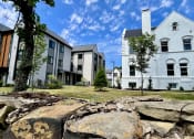 Thumbnail 1 of 18 - Exterior of Buildings with puffy clouds RESERVE OVERLOOK APARTMENTS at Reserve Overlook Apartments, Integrity Realty, Cleveland Heights, Ohio, 44106