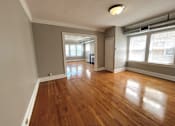 Thumbnail 33 of 37 - Living room with wood floors and windows at Integrity Cleveland Heights, Cleveland Heights, 44106