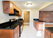 Thumbnail 14 of 32 - Well Organized Kitchen at Integrity Gold Coast Apartments in Lakewood
