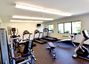 Thumbnail 13 of 15 - On-site fitness center with a variety of equipment at Integrity Medina Apartments, Medina, OH,  44256