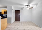 Thumbnail 9 of 22 - A room with a ceiling fan and a brown door at Integrity Medina Apartments, Medina, OH,  44256