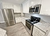 Thumbnail 12 of 14 - White Kitchen Cabinetry Remodel at Old Green Place Apartments, Integrity Realty LLC, Beachwood, 44122