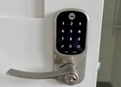 Thumbnail 11 of 29 - A keypad is attached to a door handle.