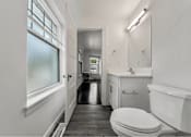 Thumbnail 20 of 29 - A white bathroom with a toilet, sink, and bathtub.