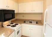 Thumbnail 7 of 13 - Standard Kitchen at Eagles Landing Apartments, Integrity Realty, Kent