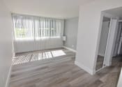 Thumbnail 2 of 13 - Spacious living room with large windows at Eagles Landing Apartments, Integrity Realty, Ohio, 44240