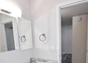 Thumbnail 8 of 13 - A renovated bathroom with two sinks at Eagles Landing Apartments, Integrity Realty, Kent