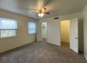 Thumbnail 21 of 22 - Large bedrooms with ceiling fan at Woodland Pointe Apartments and Townhomes, Integrity Realty, Kent, OHs