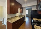 Thumbnail 11 of 22 - Renovated Kitchen at Woodland Pointe Apartments and Townhomes, Integrity Realty, Ohio, 44240