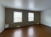 Thumbnail 18 of 22 - Spacious living room with plank at Woodland Pointe Apartments and Townhomes, Integrity Realty, Kent, OH style floors