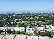 Thumbnail 14 of 14 - Aerial drone view of Rose North Apartments showing the Palms neighborhood of Los Angeles.