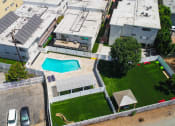 Thumbnail 22 of 22 - Aerial drone image of pool, pet play park, and community park at Cedar Glen.