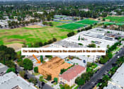 Thumbnail 15 of 15 - Aerial drone view of Tilden 2 Apartments, showing nearby Sherman Oaks Park.