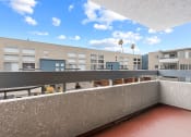 Thumbnail 14 of 29 - Covered balcony view of Hughes Regency courtyard.