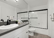 Thumbnail 9 of 31 - Modern styled bathroom with shower and tub.