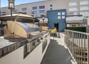 Thumbnail 21 of 29 - Courtyard BBQ and cooking area near large seating space