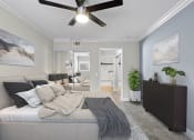 Thumbnail 6 of 29 - Large bedroom with ceiling fan.